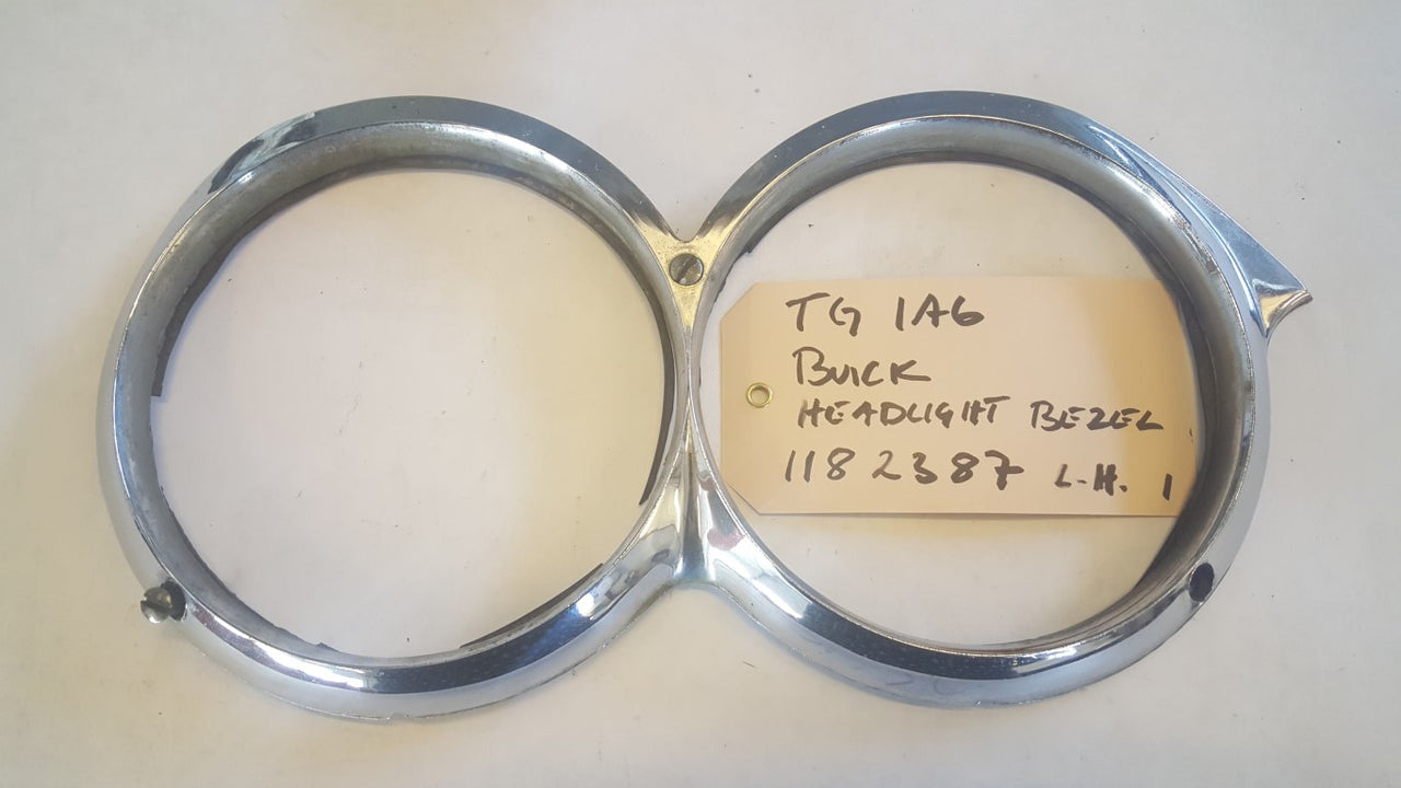 58 Buick Headlight Bezel LH - 1182387