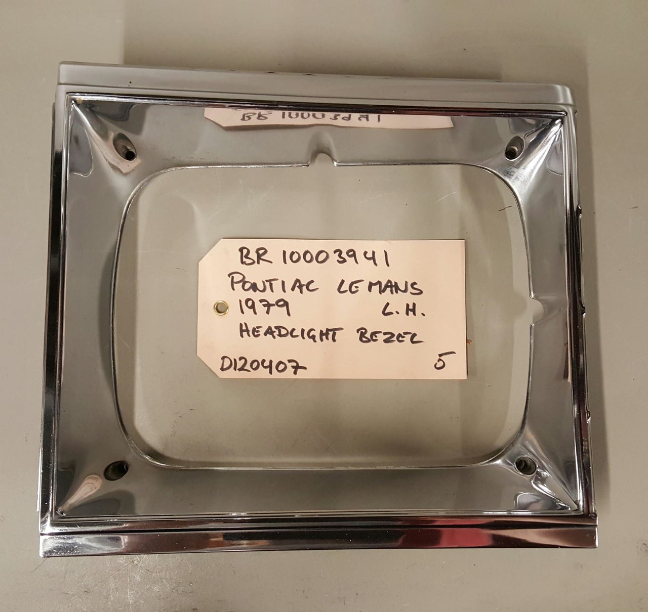 1979 Pontiac Le Mans headlight bezel LH - BR10003941